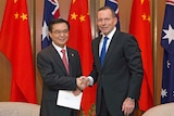 Tony Abbott shakes hands with Gao Hucheng