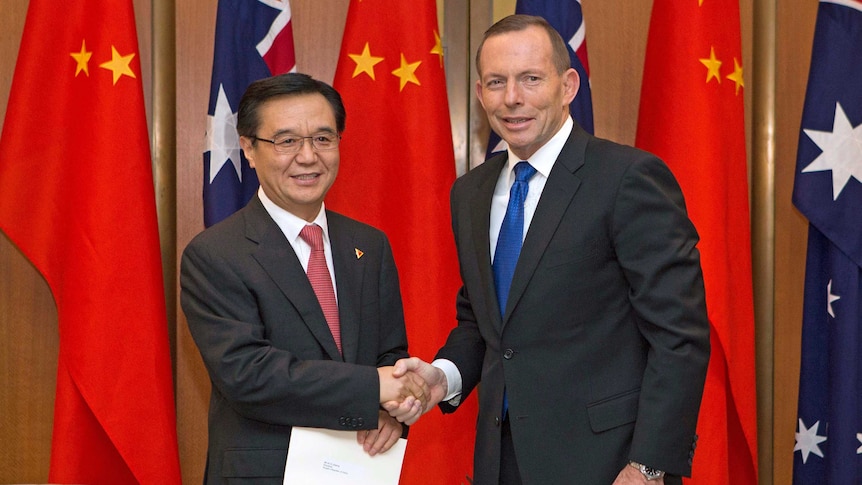 Tony Abbott shakes hands with Gao Hucheng