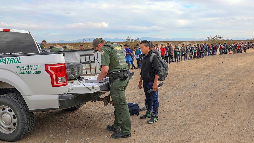 Border Patrol officers arrest Guatemalan people trying to cross the border into the US.