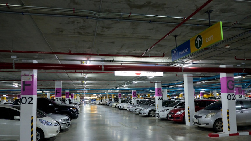 Cars lined up in a carpark in Brisbane.