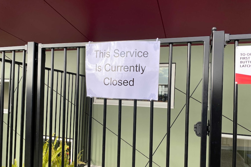 closed sign on gate of early learning centre