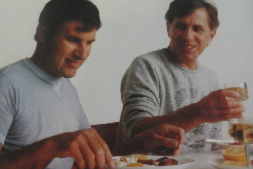 Two men eating breakfast