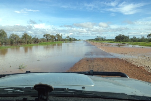 A flooded road outside Windorah after a storm on Tuesday night.