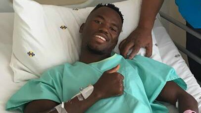 South African triathlete Mhlengi Gwala in a hospital bed