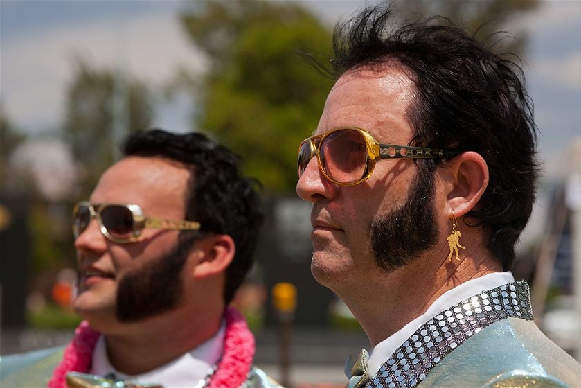 Man dressed as Elvis wearing Elvis Presley earring.