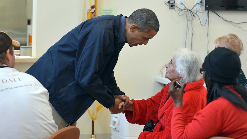 US president Barack Obama speaks with victims of superstorm Sandy at a shelter in Brigantine, New Jersey.
