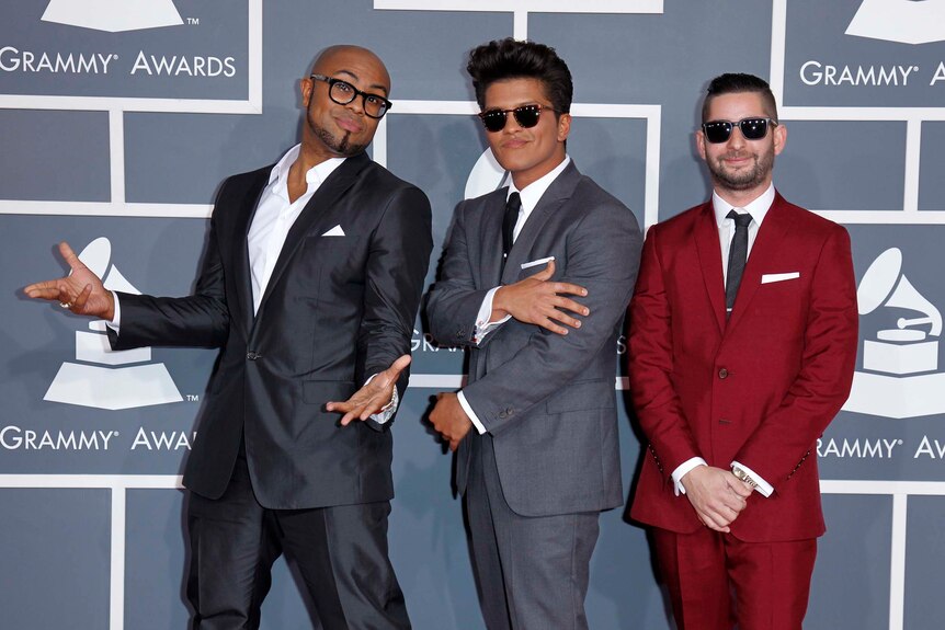 Philip Lawrence (left), Bruno Mars and Ari Levine (right), at the Grammys