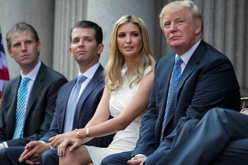 Eric, Don Jr, Ivanka and Donald Trump sit in a row.