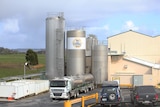 Exterior view of storage tanks at dairy factory.