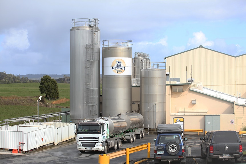 Exterior view of storage tanks at dairy factory.