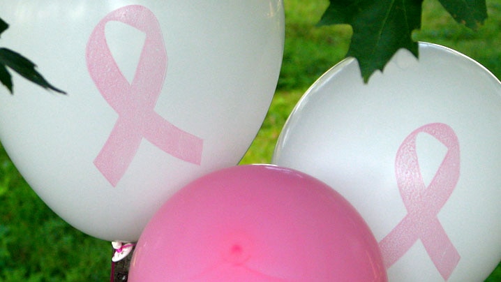 Breast cancer awareness balloons display pink ribbons