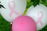 Breast cancer awareness balloons display pink ribbons