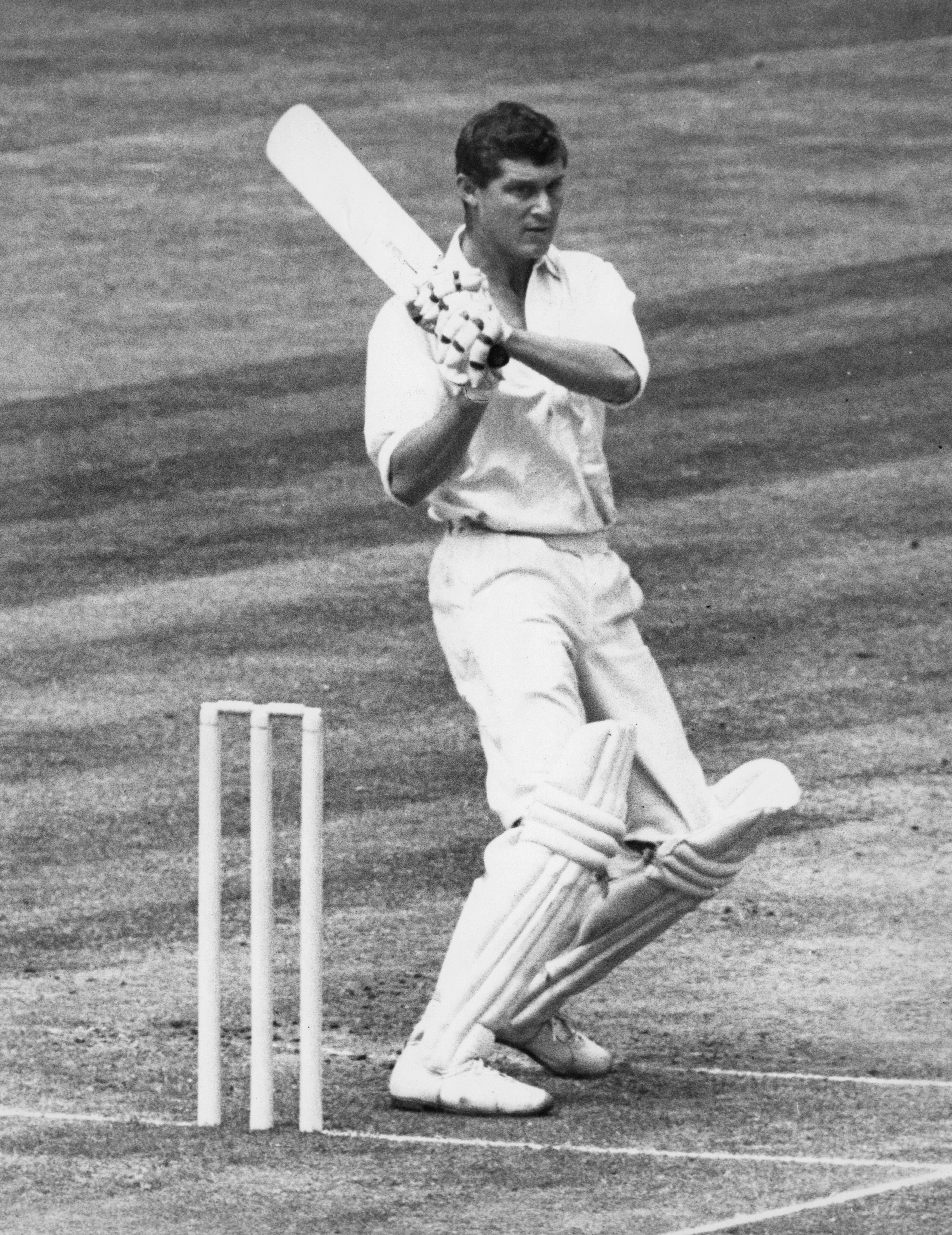 Batter Bob Cowper completes a hook shot during a Cricket game.