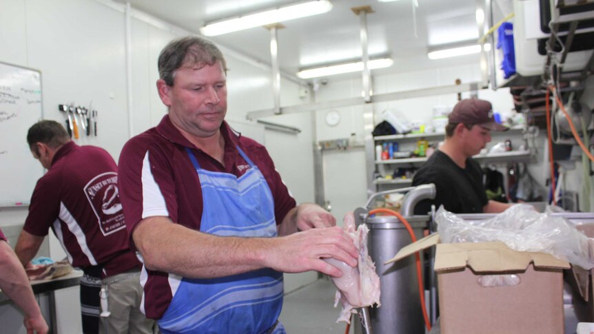 Steve Clauson breaks down a chicken carcass