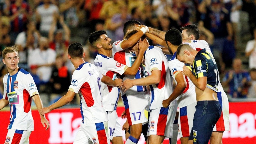 Jets players celebrate a goal