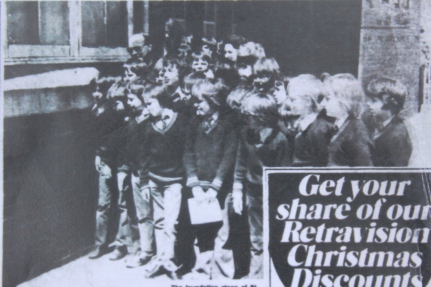 A black and white newspaper clipping of a group of school boys in 1976.