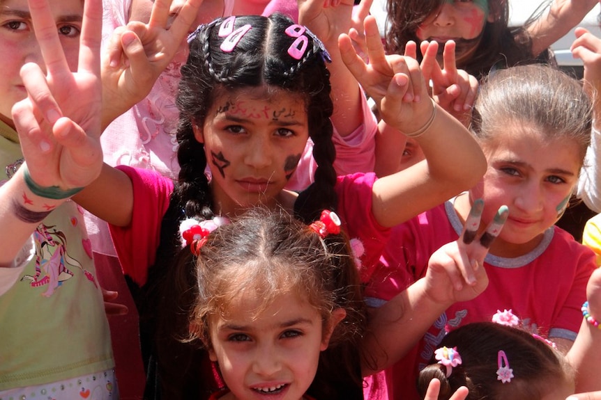 Children protest against Syria's president