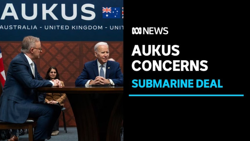 Aukus Concerns, Submarine Deal: Anthony Albanese sits at a table with Joe Biden. A banner saying 'AUKUS' is above them.