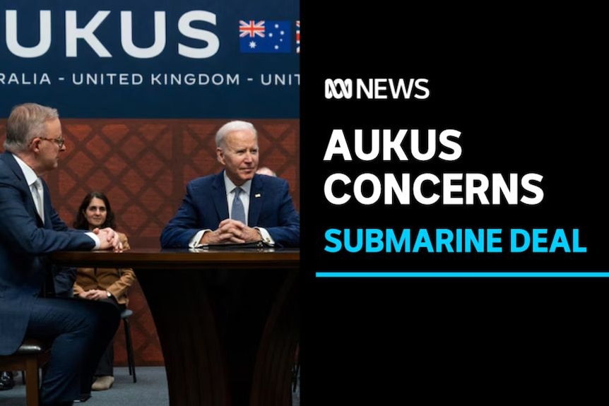 Aukus Concerns, Submarine Deal: Anthony Albanese sits at a table with Joe Biden. A banner saying 'AUKUS' is above them.