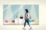 A woman walks pass shopping mall