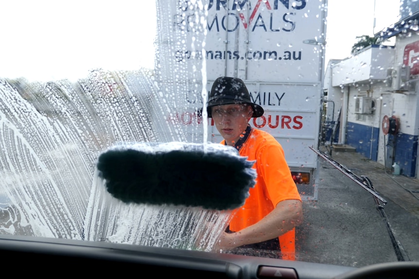 View from inside the truck, Nathing scrubbing the windscreen, soap on the glass.