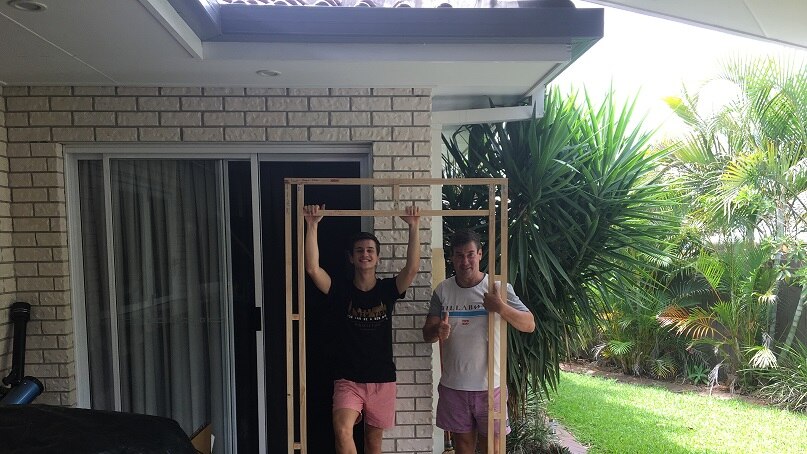 Scott and his dad building a hologram frame at their Bayside home.