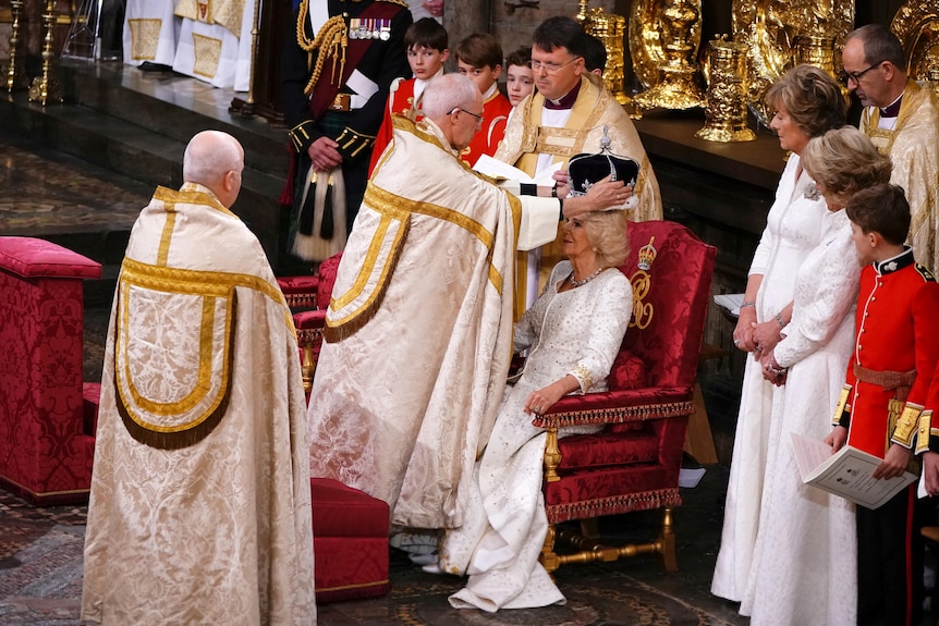 The Archbishop places a crown on Camilla's head