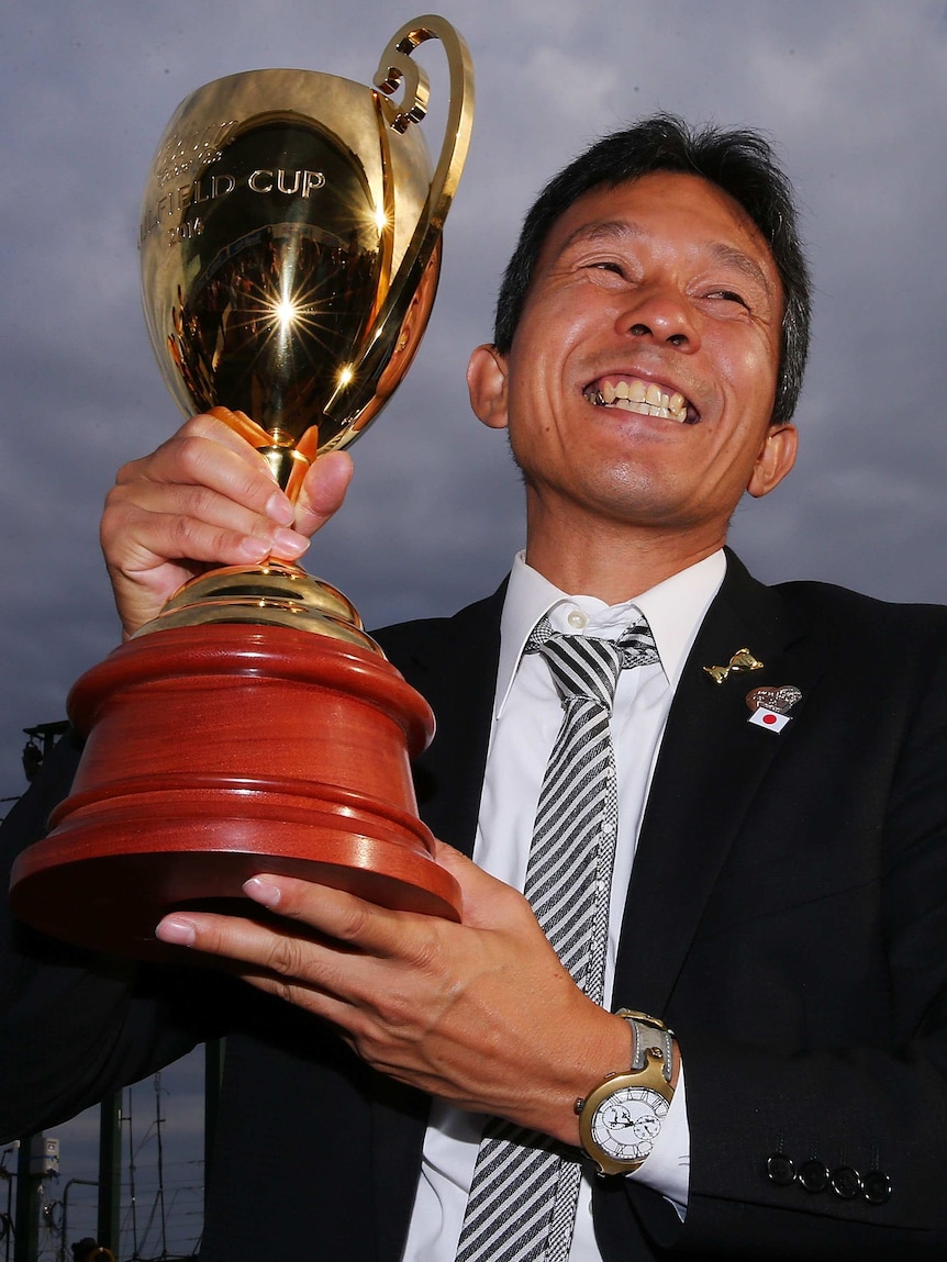 Admire Rakti trainer Tomoyuki Umeda with the Caulfield Cup trophy.