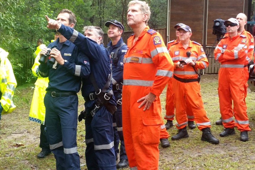 Rescue helicopter crew checking conditions at Mt Beerwah.