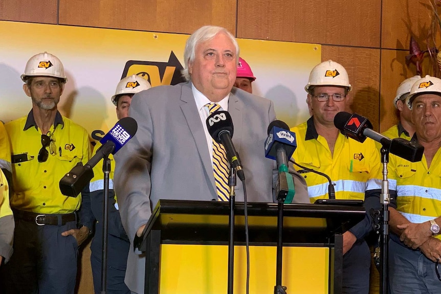 Clive Palmer stands in front of Queensland Nickel workers in Townsville.