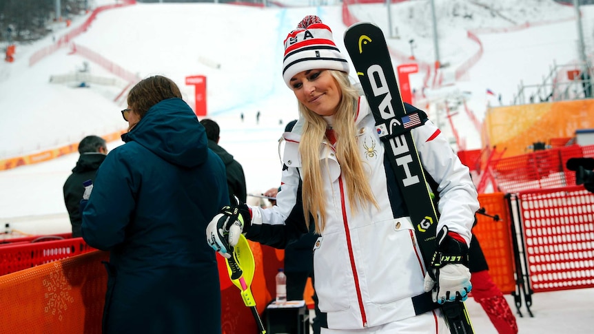 Lindsey Vonn walks through the mixed zone after the women's alpine combined at the Winter Olympics.