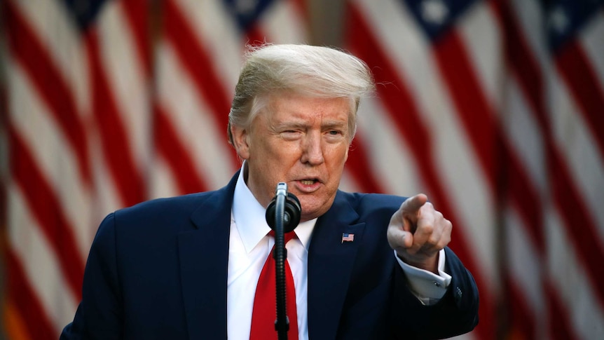 President Donald Trump points while speaking at a press conference at the White House