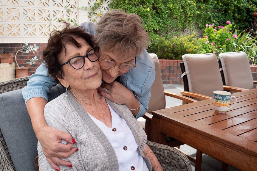 Lea hugs her mother.