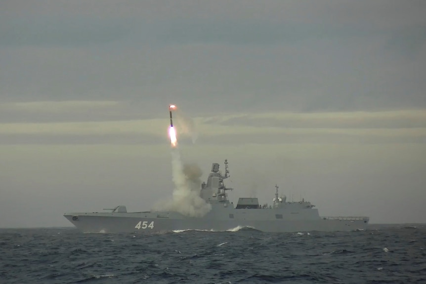 Missile launched from ship at sea.