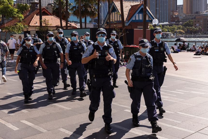 Police walk in vests to New Years celebrations