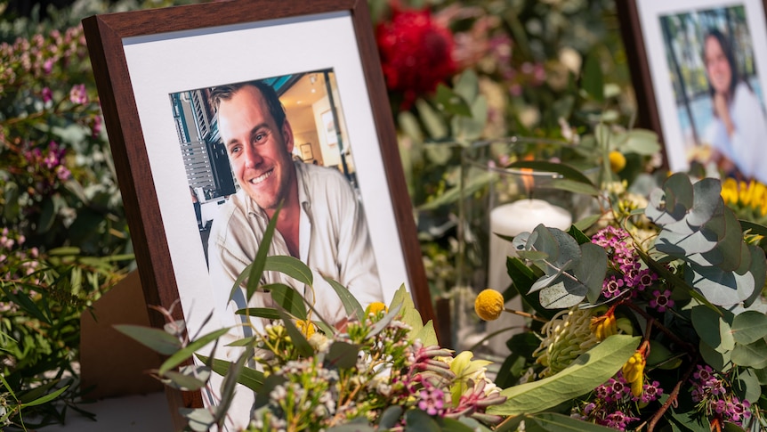 A framed photograph of a man smiling