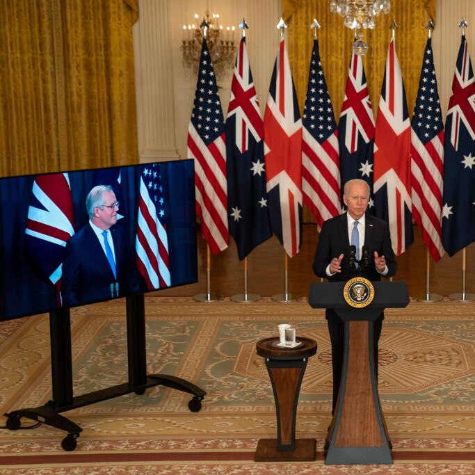 Joe Biden centre with Scott Morrison and Boris Johnson on screens beside him