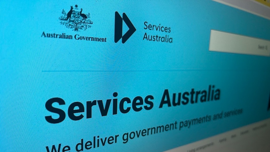 A photo of the Services Australia website with a blue background. 