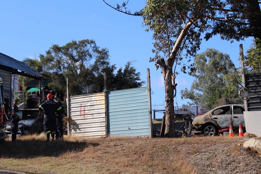 People at the scene of a Rockhampton house fire