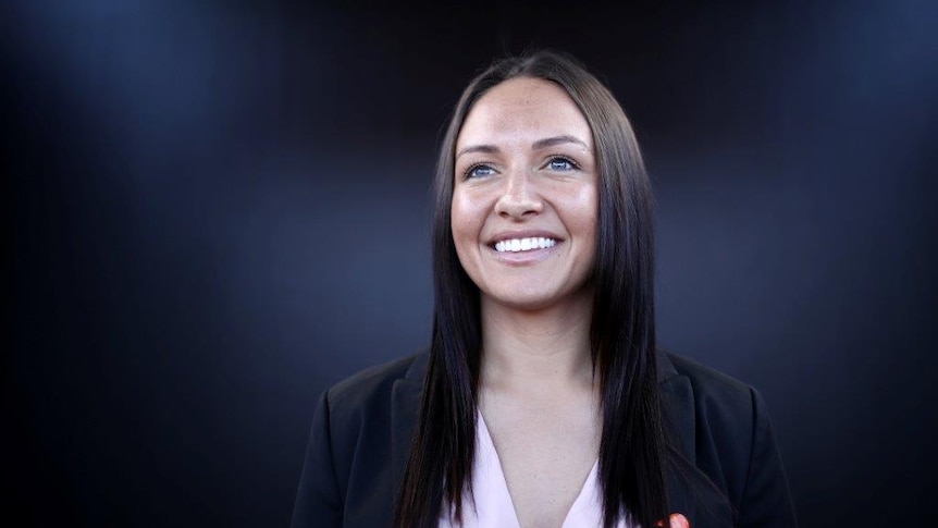 Matilda Kyah Simon smiles for the camera during an announcement.