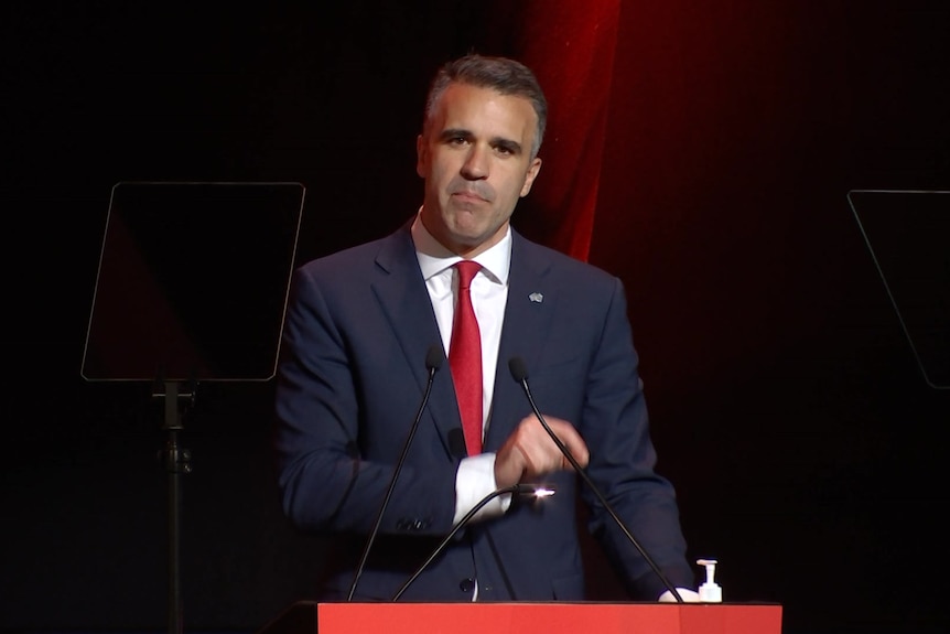 SA Labor leader Peter Malinauskas stands at a lectern.