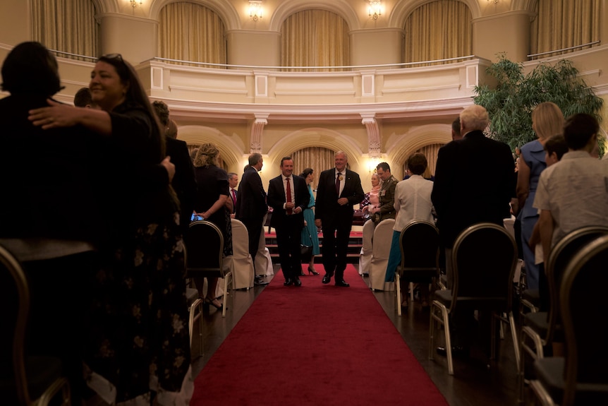 Mark McGowan walking next to Kim Beazley during the ceremony.