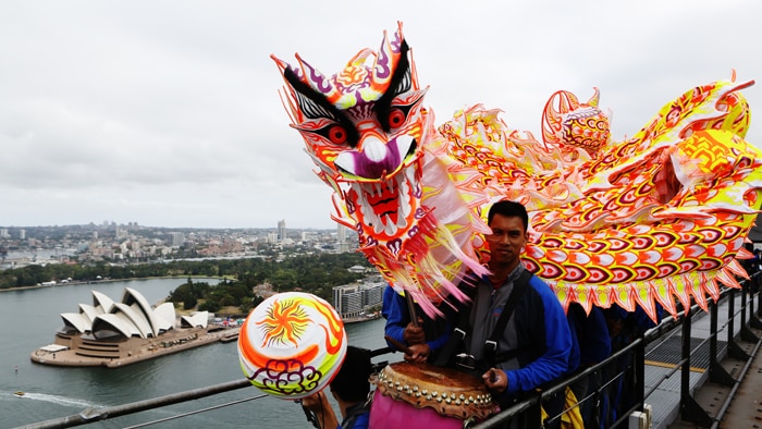 A 15-metre Chinese dragon dances up the eastern arch of the Harbour Bridge