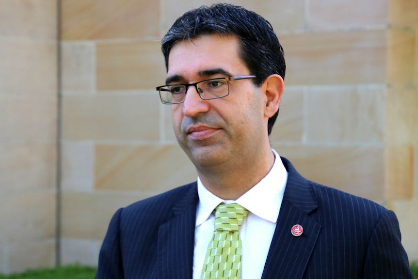 A headshot of Nick Goiran next to a photo of protesters holding pro-euthanasia signs.