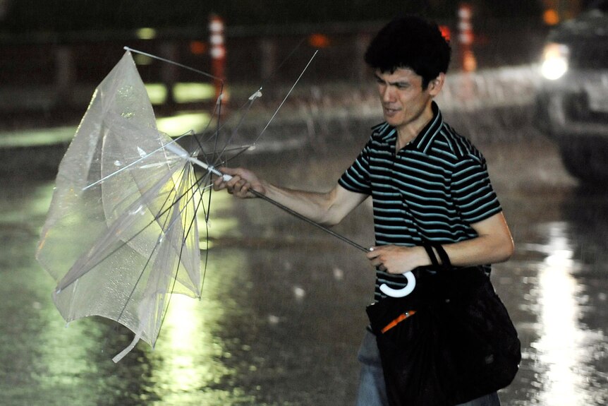 An umbrella blows out as typhoon hits Tokyo