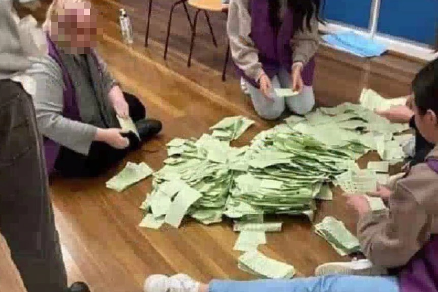 Voting staff sort votes on floor