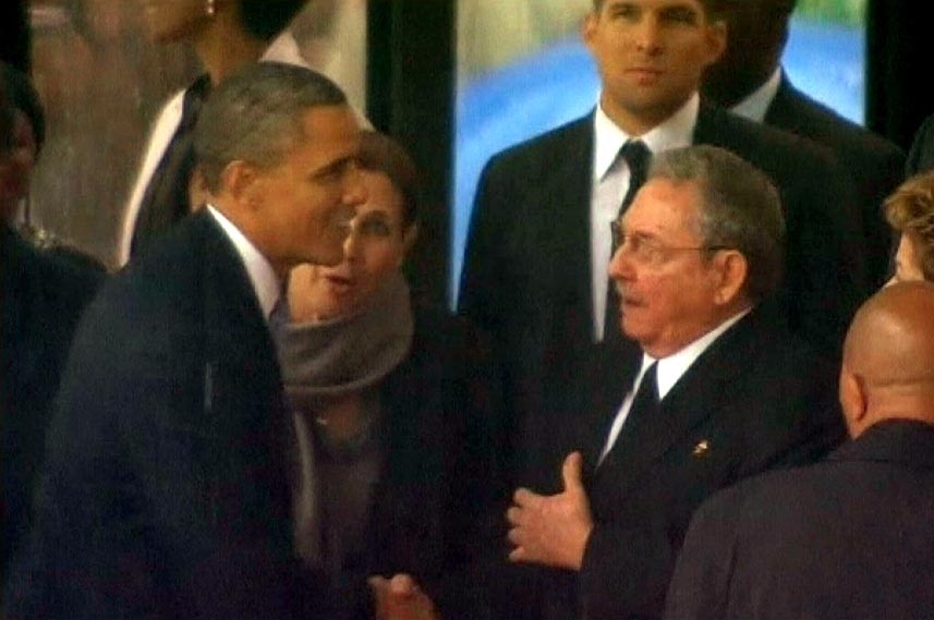 Barack Obama shakes hands with Raul Castro at the memorial service for Nelson Mandela in 2013.