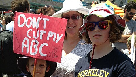 A family taking part in protests against ABC funding cuts