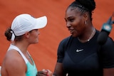 Serena Williams and Ashleigh Barty shake hands over the net at French Open