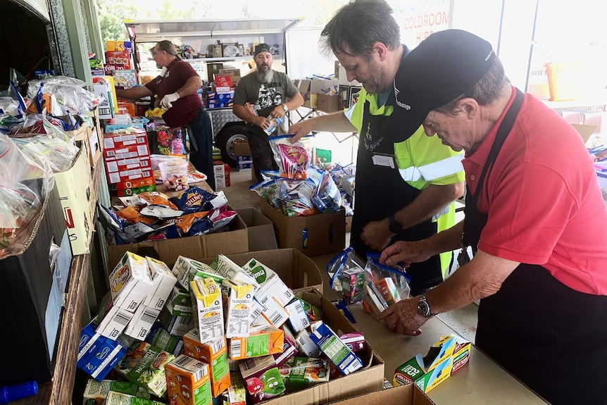 Salvation Army volunteers prepare meals for firefighters.